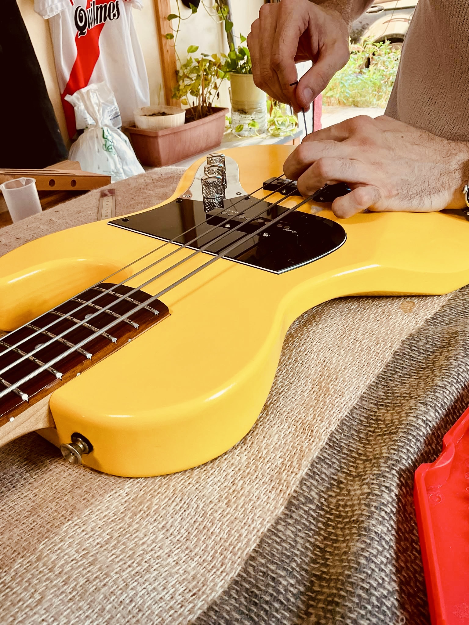 Hands at work in the Nova Basses workshop